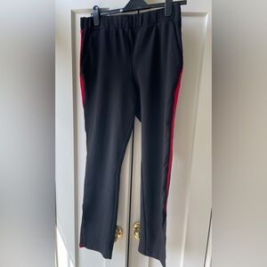 Universal Standard Black fitted ankle pants with red stripe